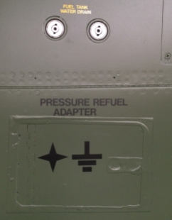 A feature that will be familiar to any pilot – fuel tank water drains, of which the F-111 has ...a lot. Below is the pressure fuel adapter door, sealed shut for display, along with most other maintenance doors and ports. (© airscape Photo)