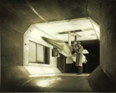 An F-111 scale model is readied for testing in the General Dynamics low speed wind tunnel. (Photo SDASM Cat # 10_0012033)