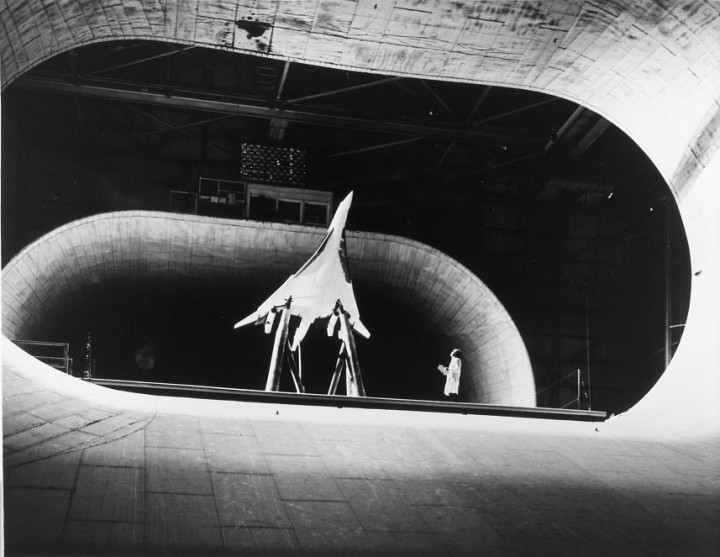 Wings fully swept, the Boeing 2707 model dwarfs a technician at NASA's Langley wind tunnel, during aerodynamic testing. (LoC P&P HAER VA,28-HAMP,4A--24)